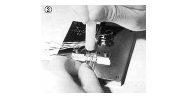 Clamp the cable and terminate each signal wire to the protector.
