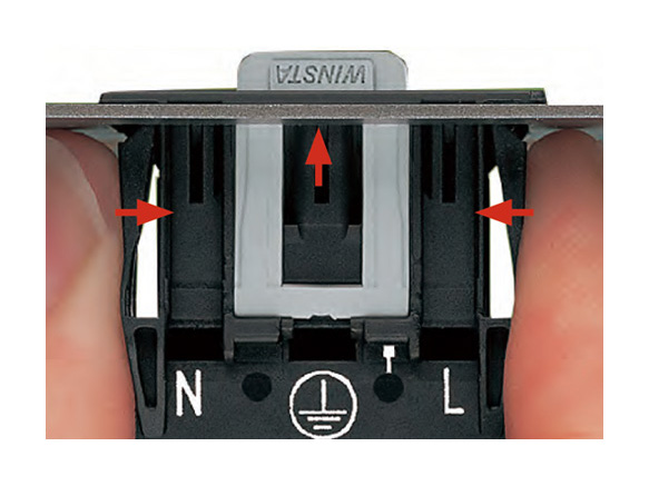 How to remove a penetration-type connector: The connector can be removed by pressing the locks on its both sides and push it forward from the back of the panel.